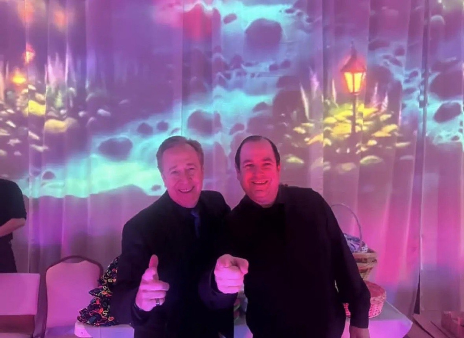Marc at an event with colorful lighting