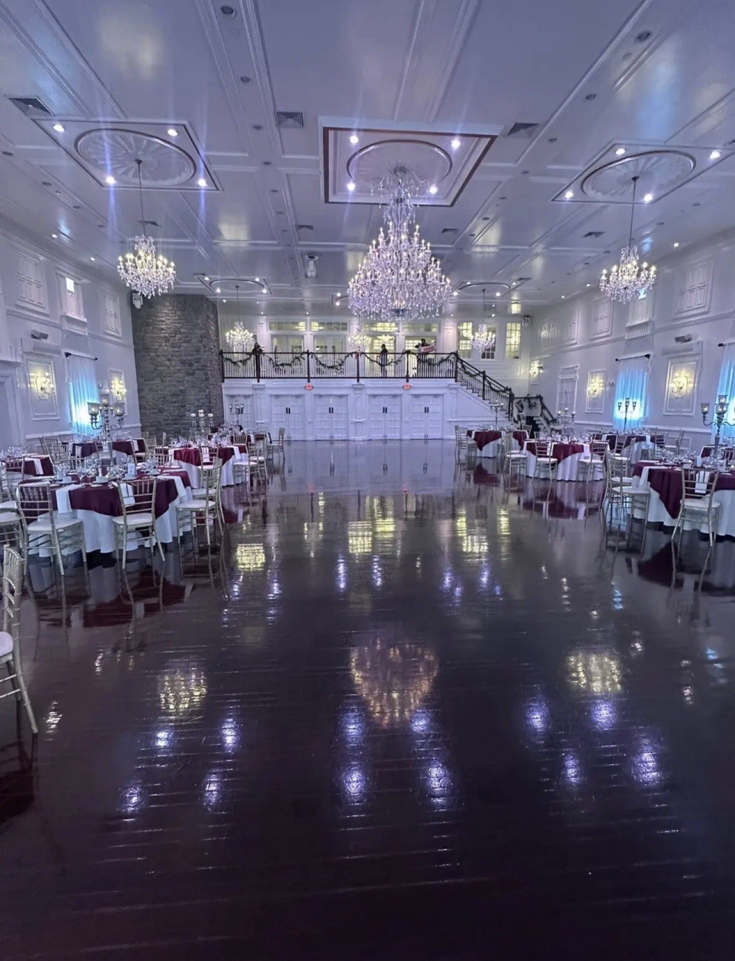 Elegant white ballroom with chandeliers